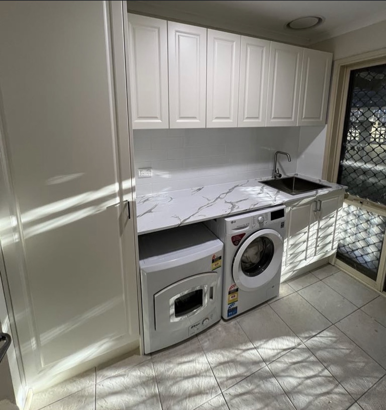 Laundry with marble splashback